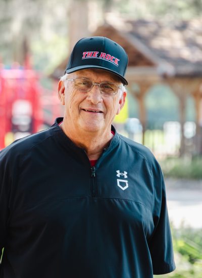 Walt Darty wearing a "The Rock" baseball cap.