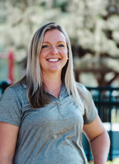 Jen Colon, a smiling woman with blonde hair, outdoors.